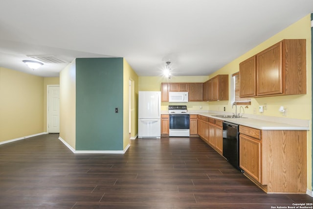 9003 Timber Frk, San Antonio, TX 78250 - kitchen featuring white appliances, dark wood finished floors, and light countertops