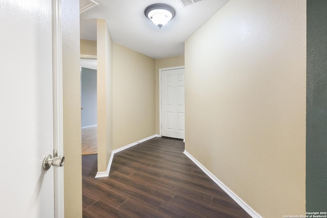 9003 Timber Frk, San Antonio, TX 78250 - hall featuring dark wood-style flooring and baseboards