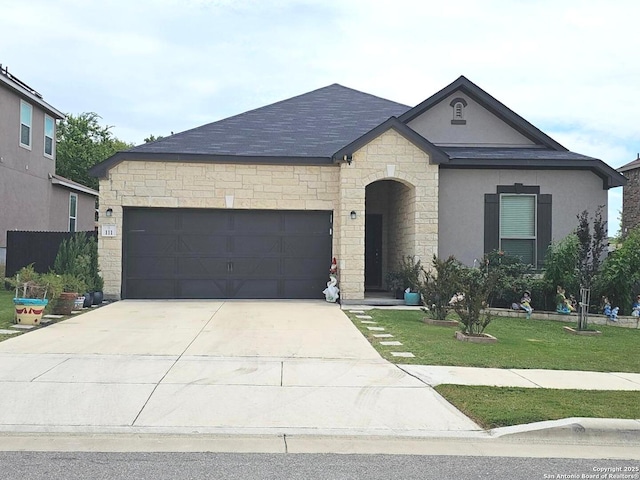 111 Lone Fls, Universal City, TX 78148 - french country inspired facade featuring an attached garage, driveway, stucco siding, stone siding, and a front yard
