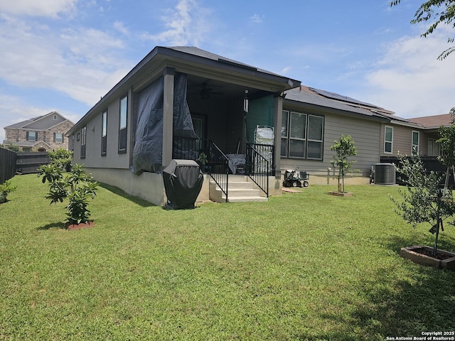 111 Lone Fls, Universal City, TX 78148 - rear view of house with a ceiling fan and roof mounted solar panels