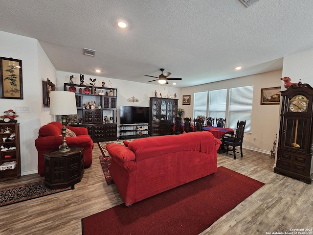 111 Lone Fls, Universal City, TX 78148 - living area with wood finished floors, a textured ceiling, ceiling fan, and recessed lighting