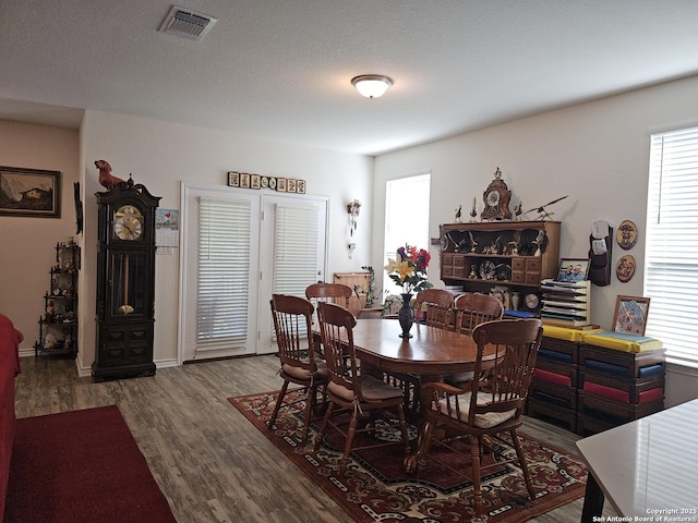 111 Lone Fls, Universal City, TX 78148 - dining space featuring healthy amount of natural light and wood finished floors