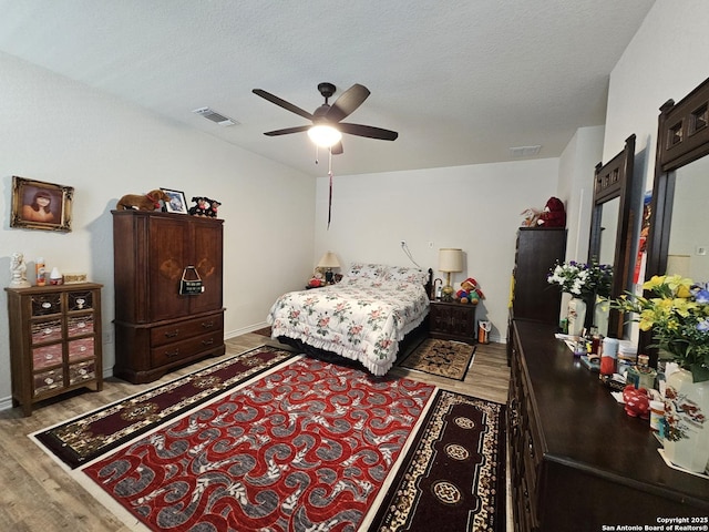 111 Lone Fls, Universal City, TX 78148 - bedroom featuring light wood-style floors, ceiling fan, and a textured ceiling