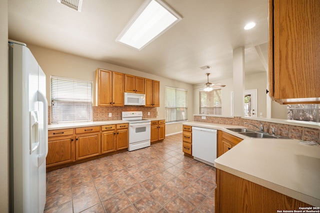 3837 Arroyo Seco, Schertz, TX 78154 - kitchen with white appliances, backsplash, plenty of natural light, ceiling fan, and recessed lighting