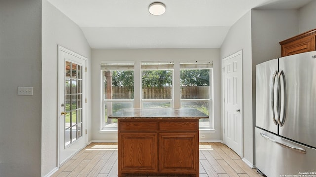 2166 Jolie, New Braunfels, TX 78130 - kitchen with freestanding refrigerator, vaulted ceiling, light wood-style flooring, and healthy amount of natural light