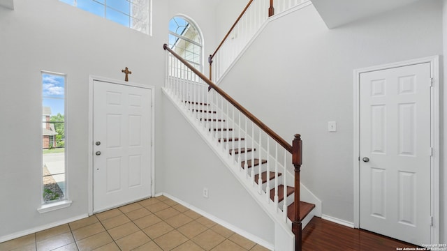 2166 Jolie, New Braunfels, TX 78130 - foyer with healthy amount of natural light, a high ceiling, stairway, and tile patterned flooring