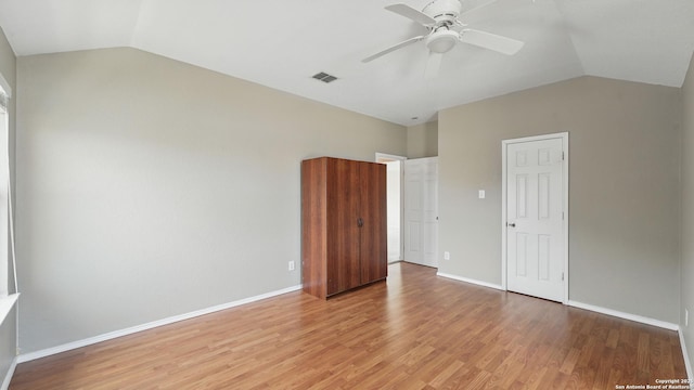 2166 Jolie, New Braunfels, TX 78130 - unfurnished bedroom featuring vaulted ceiling, light wood-type flooring, and ceiling fan