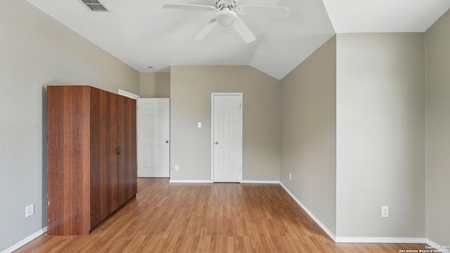 2166 Jolie, New Braunfels, TX 78130 - unfurnished bedroom featuring light wood-style flooring, lofted ceiling, and a ceiling fan