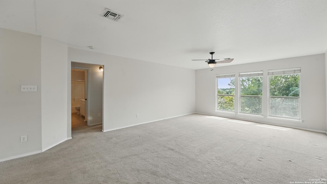 2166 Jolie, New Braunfels, TX 78130 - carpeted spare room featuring baseboards and a ceiling fan