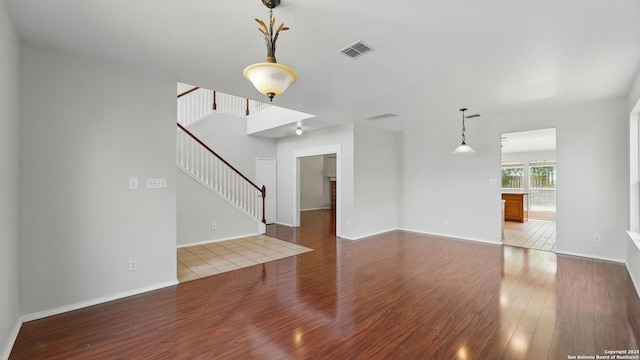 2166 Jolie, New Braunfels, TX 78130 - unfurnished living room featuring wood finished floors and stairs