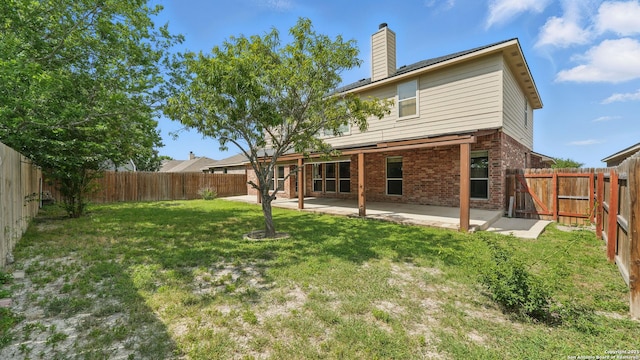 2166 Jolie, New Braunfels, TX 78130 - rear view of house with brick siding, a chimney, a fenced backyard, and a patio