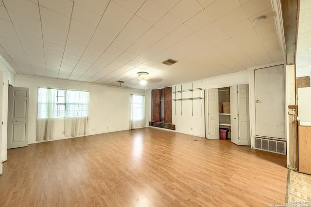 613 Drake Ave, San Antonio, TX 78204 - spare room with light wood-style floors and a smoke detector