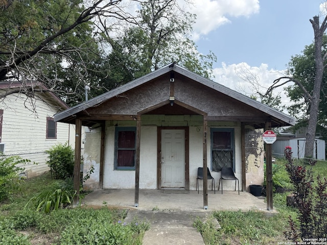 330 Madero, San Antonio, TX 78207 - view of front of property with covered porch and concrete block siding