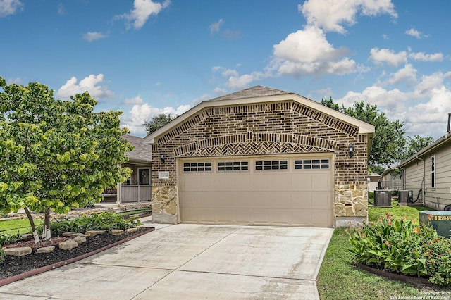 3354 Blossom Row, San Antonio, TX 78253 - view of front of house with brick siding, a garage, stone siding, and driveway