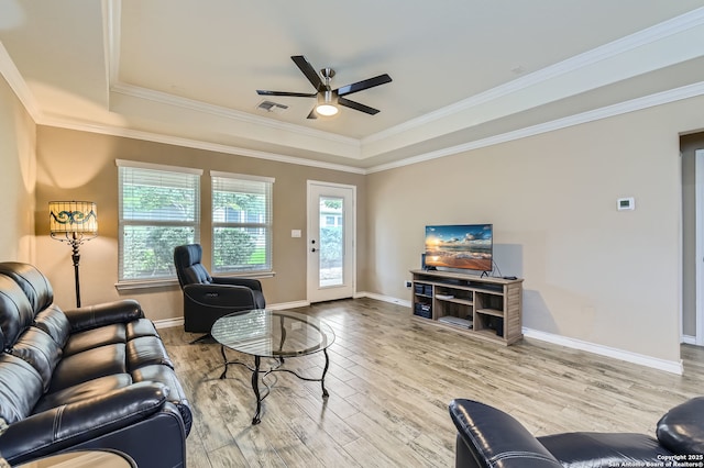 3354 Blossom Row, San Antonio, TX 78253 - living area featuring a tray ceiling, a ceiling fan, wood finished floors, and crown molding