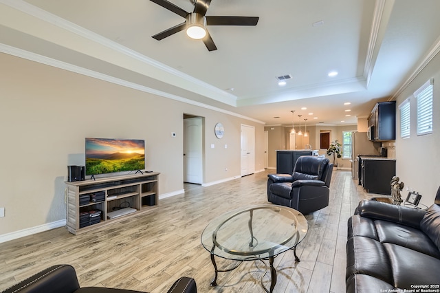 3354 Blossom Row, San Antonio, TX 78253 - living area with a raised ceiling, light wood-type flooring, a ceiling fan, crown molding, and recessed lighting