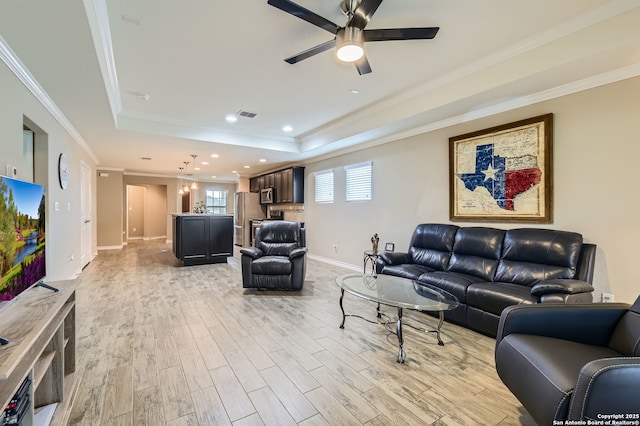 3354 Blossom Row, San Antonio, TX 78253 - living room with a raised ceiling, light wood-type flooring, a ceiling fan, ornamental molding, and recessed lighting
