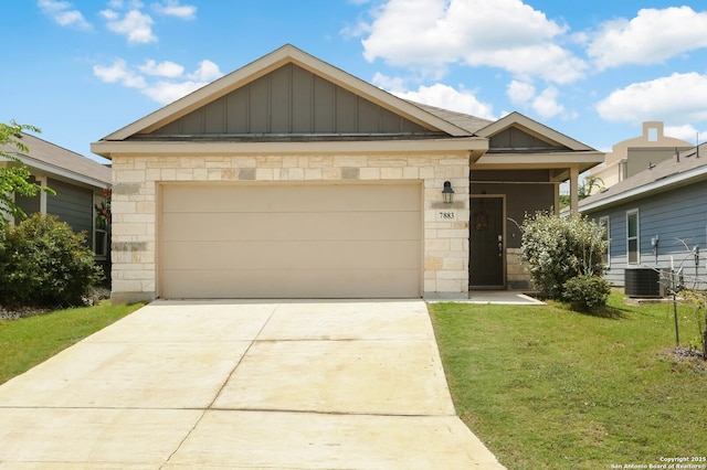 7883 Abbey, San Antonio, TX 78218 - view of front of home featuring a front yard, board and batten siding, driveway, and stone siding