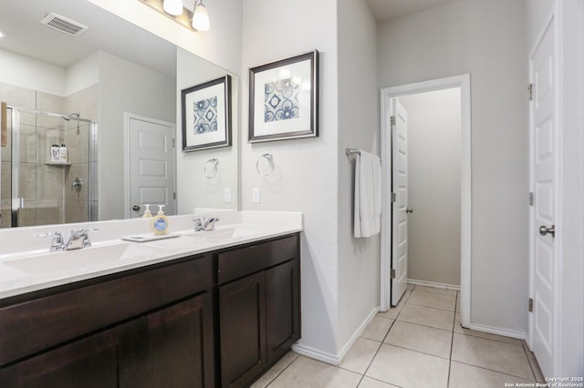 7883 Abbey, San Antonio, TX 78218 - bathroom featuring double vanity, a stall shower, and tile patterned floors