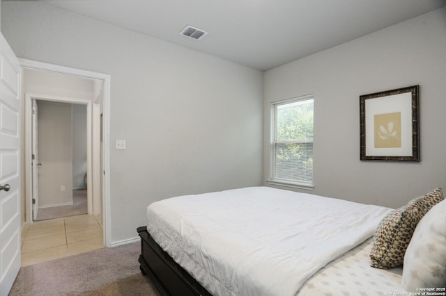 7883 Abbey, San Antonio, TX 78218 - bedroom with light carpet and light tile patterned floors
