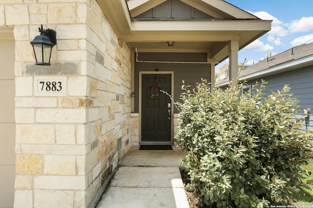 7883 Abbey, San Antonio, TX 78218 - property entrance featuring stone siding and board and batten siding