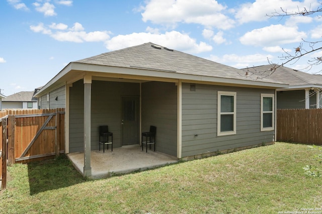 7883 Abbey, San Antonio, TX 78218 - rear view of house featuring a patio area and a shingled roof