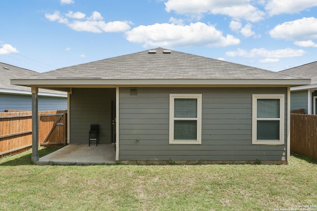 7883 Abbey, San Antonio, TX 78218 - back of house with a patio area and roof with shingles