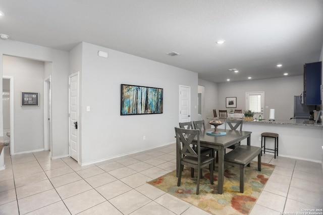 7883 Abbey, San Antonio, TX 78218 - dining space with light tile patterned flooring and recessed lighting