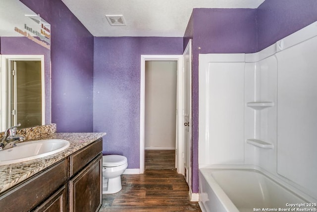 2907 Emery, San Antonio, TX 78222 - full bath featuring vanity, wood finished floors, and shower / bath combination