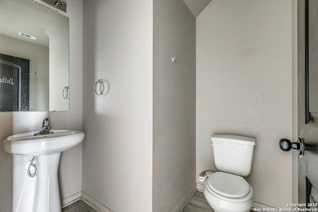 2907 Emery, San Antonio, TX 78222 - bathroom featuring toilet and baseboards