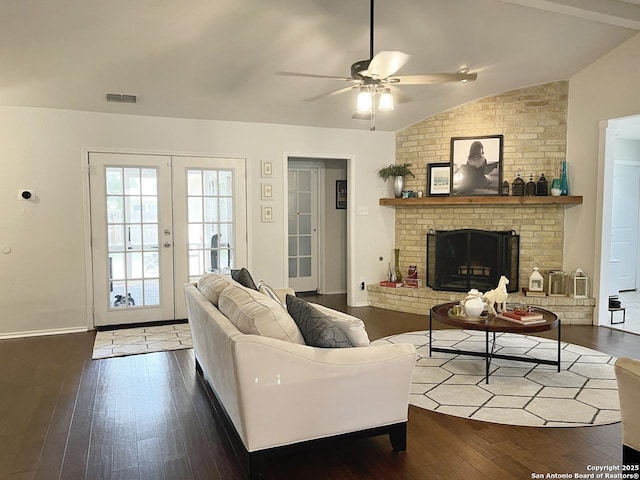 15115 Mission Oaks St, San Antonio, TX 78232 - living room featuring hardwood / wood-style flooring, vaulted ceiling, ceiling fan, a fireplace, and french doors