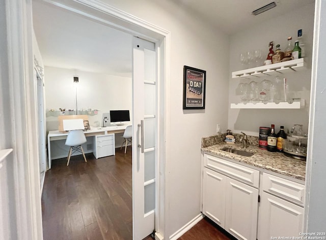 15115 Mission Oaks St, San Antonio, TX 78232 - indoor wet bar featuring dark wood finished floors