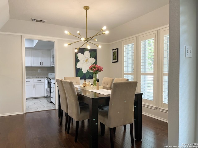 15115 Mission Oaks St, San Antonio, TX 78232 - dining area with a chandelier, wood-type flooring, plenty of natural light, and vaulted ceiling