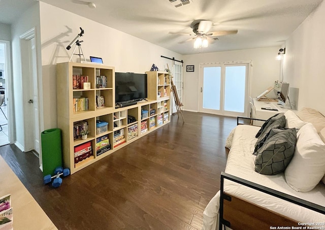 15115 Mission Oaks St, San Antonio, TX 78232 - living room featuring wood finished floors, a ceiling fan, and a barn door