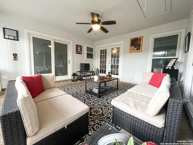 15115 Mission Oaks St, San Antonio, TX 78232 - living room with french doors, a ceiling fan, and a decorative wall