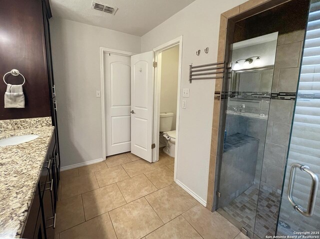 15115 Mission Oaks St, San Antonio, TX 78232 - bathroom with vanity, tile patterned floors, and a stall shower