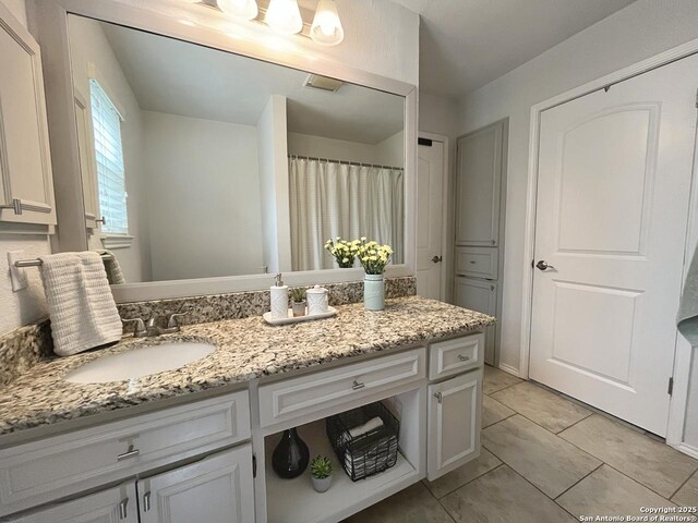 15115 Mission Oaks St, San Antonio, TX 78232 - bathroom with vanity, tile patterned floors, and a shower with curtain