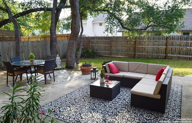 15115 Mission Oaks St, San Antonio, TX 78232 - fenced backyard featuring an outdoor hangout area, outdoor dining space, and a patio area