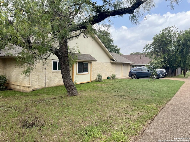 15115 Mission Oaks St, San Antonio, TX 78232 - view of side of property featuring an attached garage, brick siding, a yard, and a shingled roof