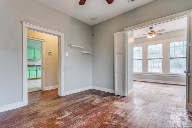 521 Kayton, San Antonio, TX 78210 - unfurnished room with a ceiling fan and hardwood / wood-style floors