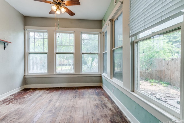 521 Kayton, San Antonio, TX 78210 - unfurnished sunroom featuring wood-type flooring and baseboards