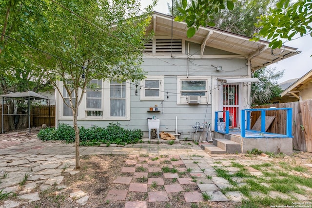 521 Kayton, San Antonio, TX 78210 - rear view of house with a fenced backyard, a patio area, and cooling unit