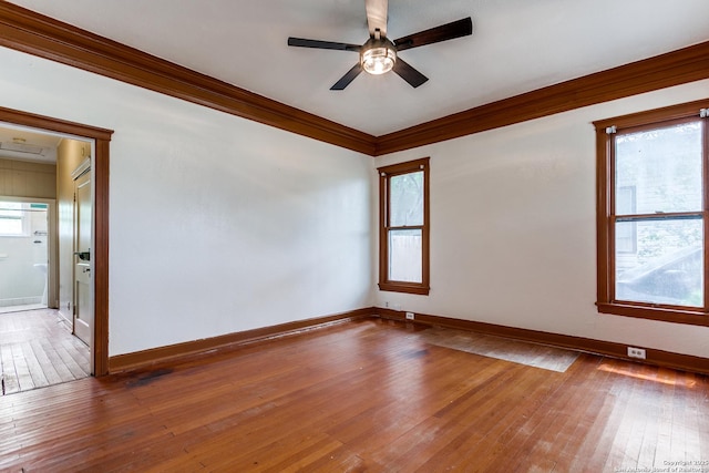 521 Kayton, San Antonio, TX 78210 - spare room with ornamental molding, ceiling fan, and hardwood / wood-style floors