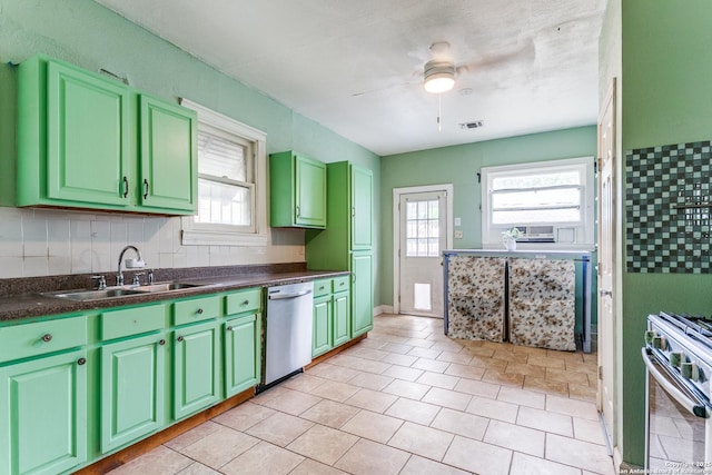 521 Kayton, San Antonio, TX 78210 - kitchen with dishwasher, gas stove, ceiling fan, green cabinetry, and dark countertops