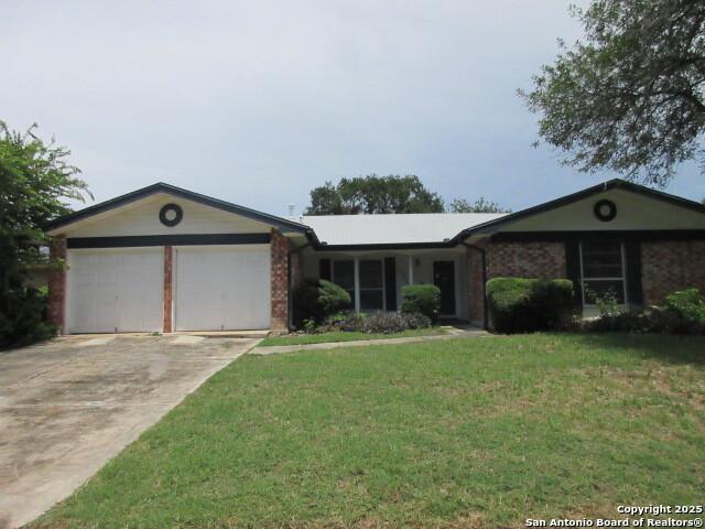 13002 Larklair, San Antonio, TX 78233 - ranch-style house with a garage, concrete driveway, a front yard, and brick siding