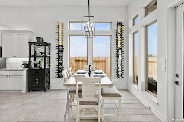 2905 Harvest Moon, Seguin, TX 78155 - dining room with a chandelier, a high ceiling, and light tile patterned floors