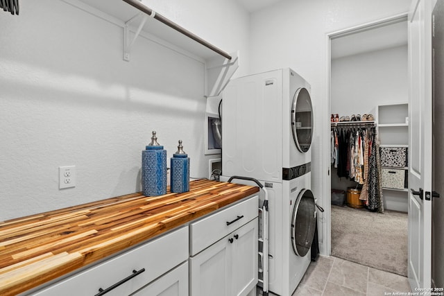 2905 Harvest Moon, Seguin, TX 78155 - washroom with stacked washer / dryer and cabinet space