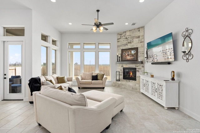 2905 Harvest Moon, Seguin, TX 78155 - living room with a ceiling fan, plenty of natural light, a stone fireplace, and recessed lighting