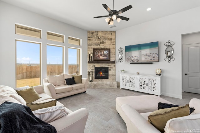 2905 Harvest Moon, Seguin, TX 78155 - living area featuring a ceiling fan, a stone fireplace, and recessed lighting