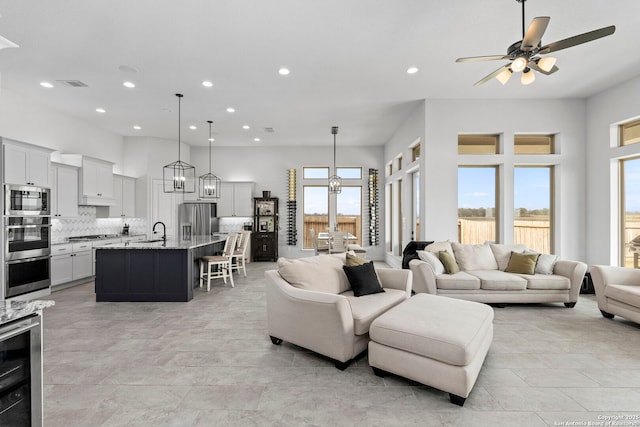 2905 Harvest Moon, Seguin, TX 78155 - living room with recessed lighting, plenty of natural light, ceiling fan, and wine cooler